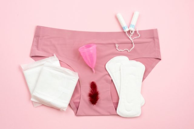 Period sanitary products next to blood-stained underwear