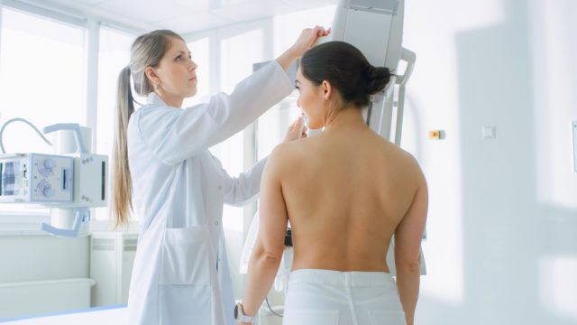Woman receiving mammogram at the doctor's office.