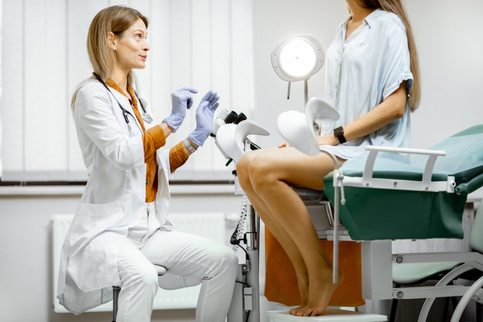 woman sitting with her gynecologist, ready to check a Bartholin Cyst.