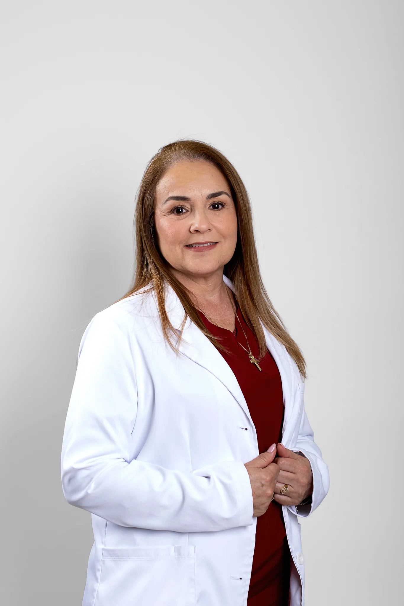 Female doctor in white coat smiling